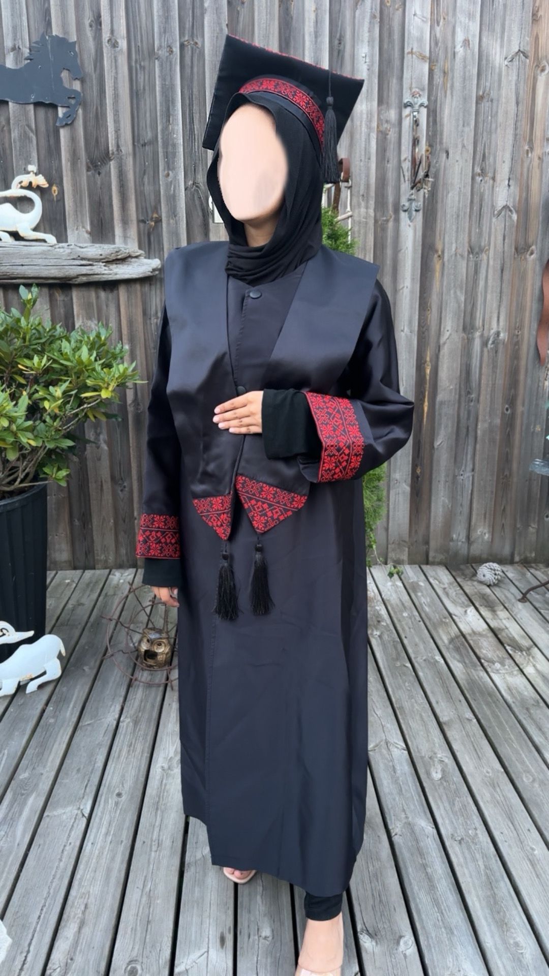 Graduation robe, scraf anad hat with the traditional Palestinan embroidery