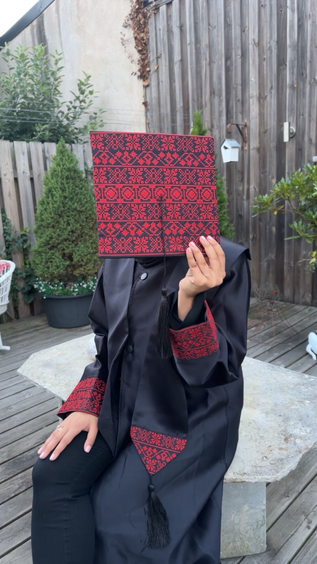 Graduation robe, scraf anad hat with the traditional Palestinan embroidery