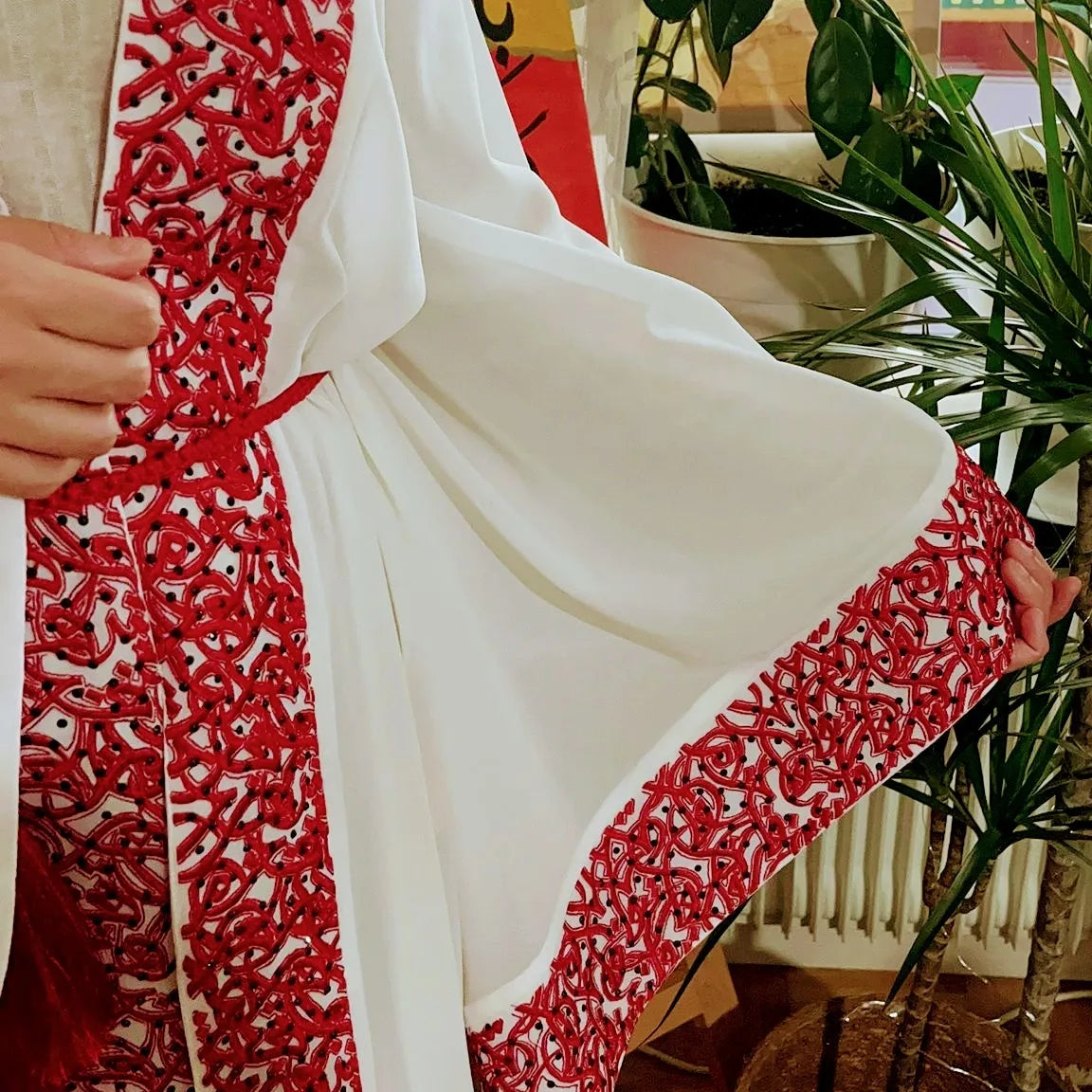 White Abaya beaded with Red traditional embroidery .