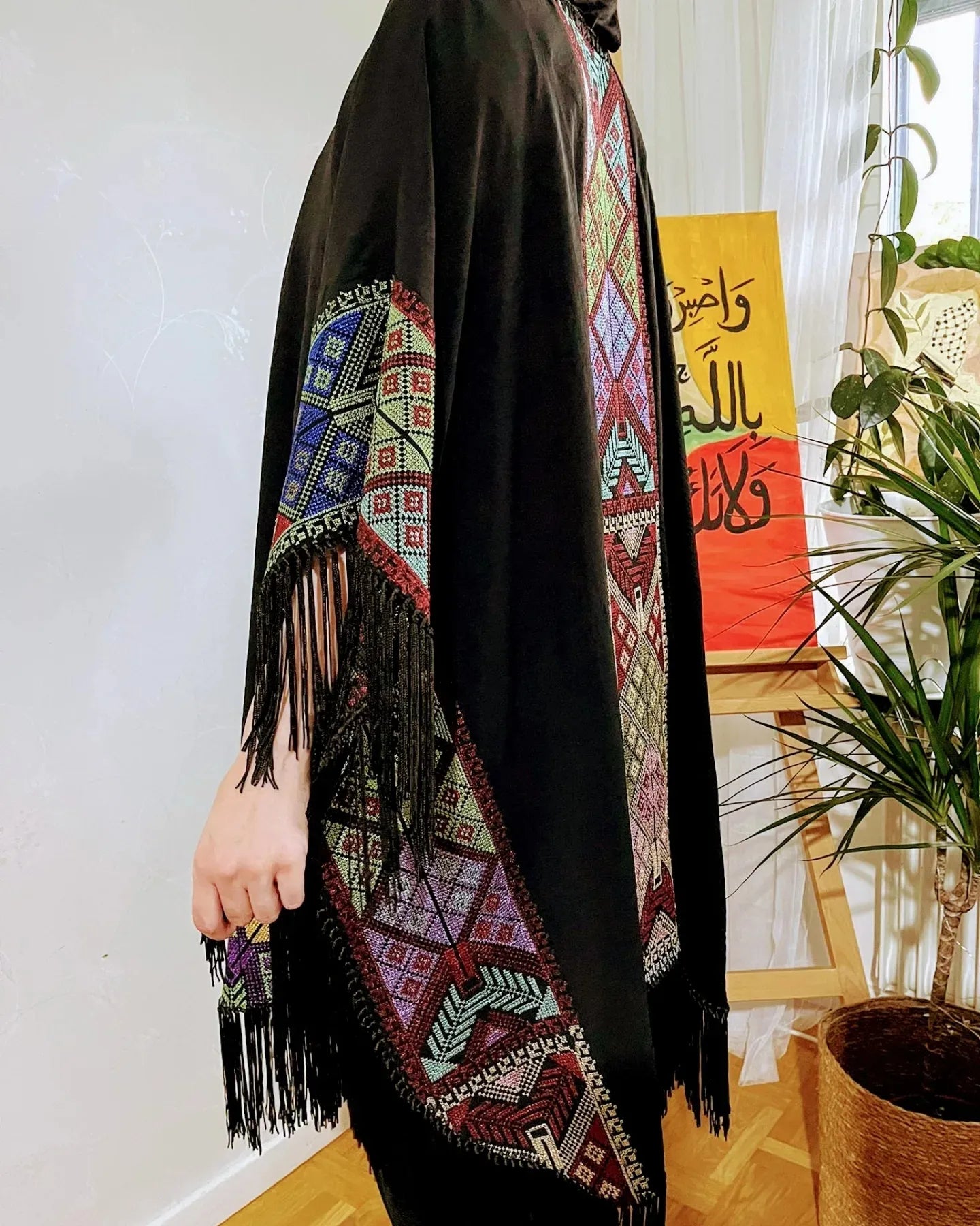 Cape with colorful traditional embroidery .