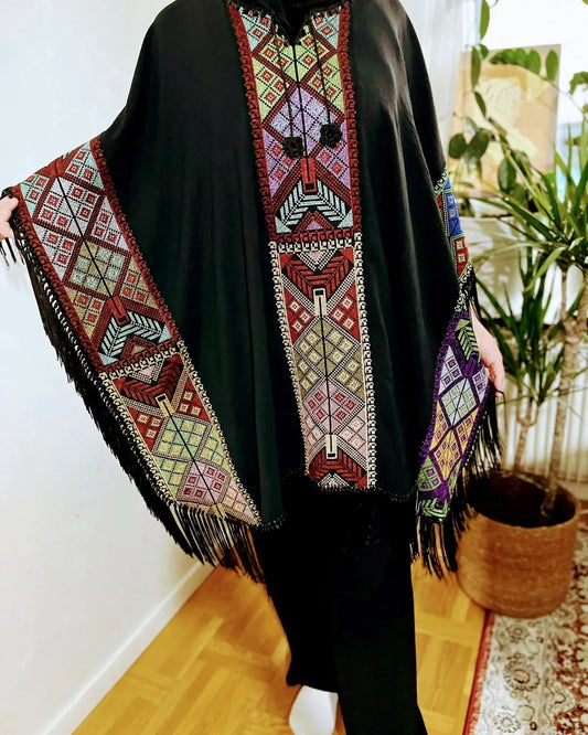 Cape with colorful traditional embroidery .