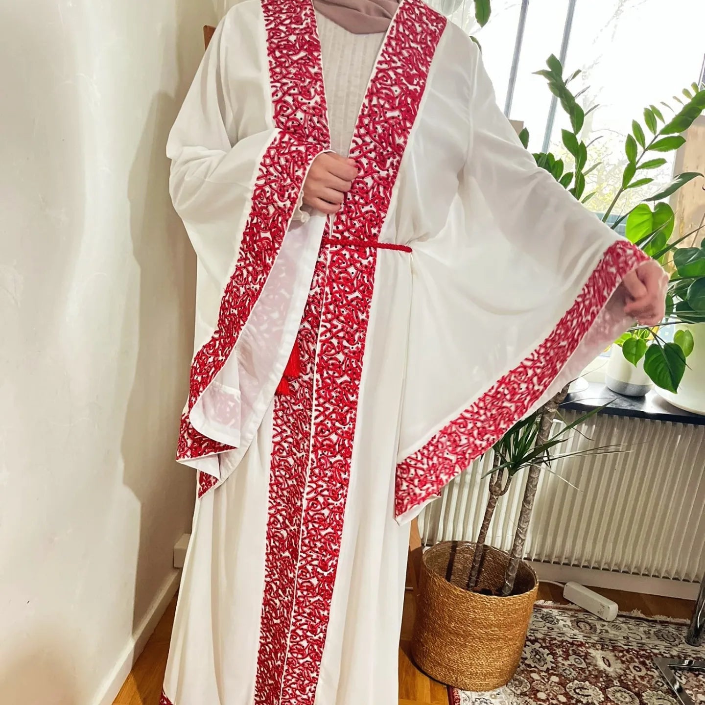 White Abaya beaded with Red traditional embroidery .